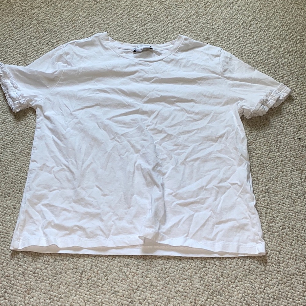 Plain white tea with ruffle sleeves